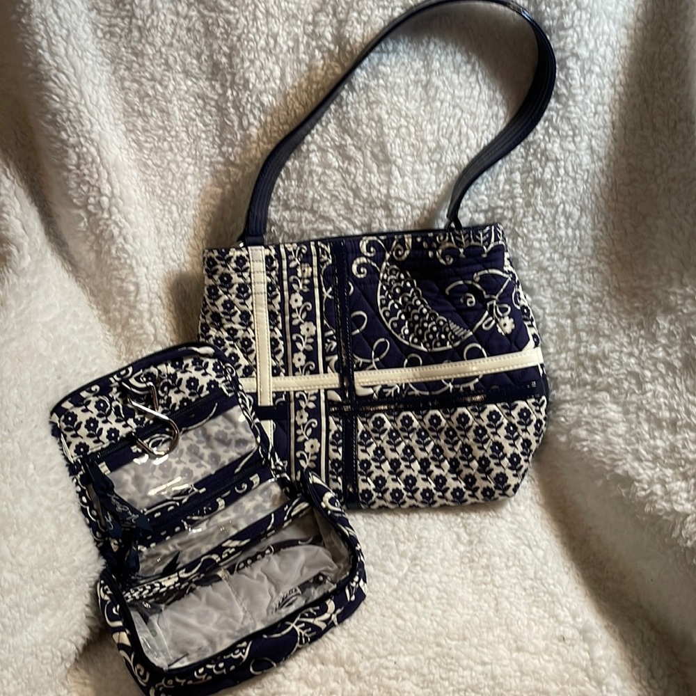Super cute, vera Bradley set. Includes a little travel bag along with the purse.